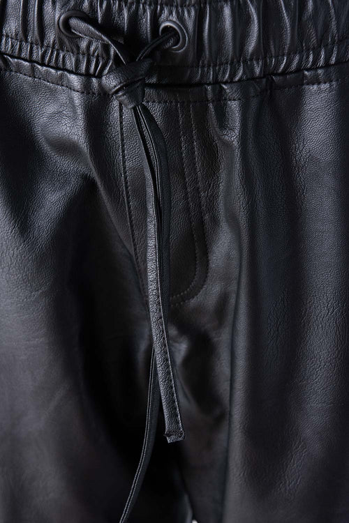 Card slide image -  JOGGER DE MOVIES NEGRO CON BOLSILLOS PARA MUJER