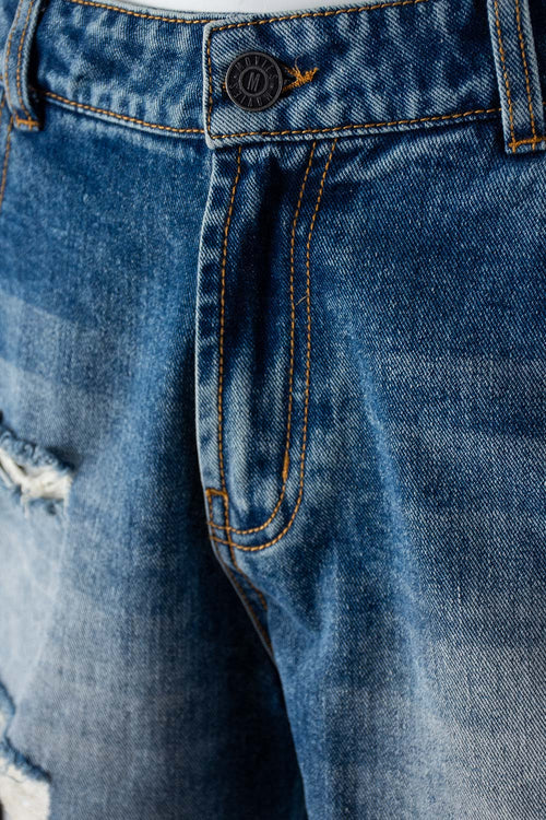 Card slide image -  SHORT DE MOVIES EN DENIM TONO MEDIO CON ROTOS PARA MUJER