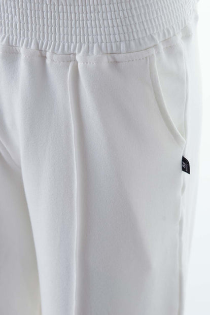  JOGGER DE MOVIES CON BOLSILLOS MARFIL PARA MUJER