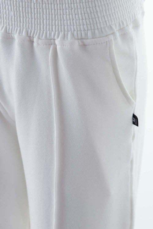Card slide image -  JOGGER DE MOVIES CON BOLSILLOS MARFIL PARA MUJER