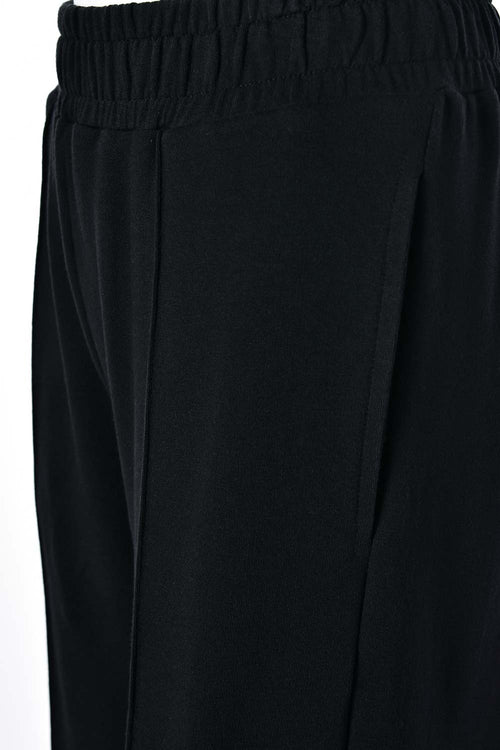 Card slide image -  JOGGER DE MOVIES TIPO CARGO NEGRO PARA MUJER